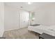 Cozy bedroom with neutral walls, carpet, and double door closet at 790 Riverwood Pass, Dallas, GA 30157