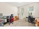 Bright bedroom with neutral carpet, large windows, and versatile space for personalization or use as an office at 790 Riverwood Pass, Dallas, GA 30157
