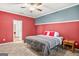 Cozy bedroom with two-toned walls, soft carpet, and ceiling fan for comfort at 790 Riverwood Pass, Dallas, GA 30157