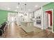 Open kitchen boasts a large island, stainless appliances, and a view into the living area at 790 Riverwood Pass, Dallas, GA 30157