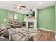 Stylish living room featuring a fireplace, mantel, and a wall-mounted television at 790 Riverwood Pass, Dallas, GA 30157