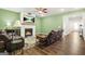 Cozy living room features a fireplace, hardwood floors, and comfortable seating at 790 Riverwood Pass, Dallas, GA 30157