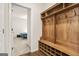 Mudroom with wood floors, a built-in organizer, and a view into the bedroom at 790 Riverwood Pass, Dallas, GA 30157