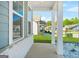 Covered porch showing brick column bases with view of lawn and community at 790 Riverwood Pass, Dallas, GA 30157