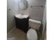 A well-kept bathroom features a pedestal sink and toilet with all the essentials for your convenience at 222 Flat Creek Ct, Peachtree City, GA 30269