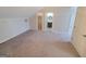 An open bedroom with gray carpet, neutral walls, and access to a closet and bathroom, creating a peaceful retreat at 222 Flat Creek Ct, Peachtree City, GA 30269