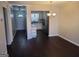 Open dining area featuring hardwood floors with a view of kitchen at 222 Flat Creek Ct, Peachtree City, GA 30269