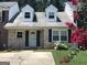 Charming brick home featuring a well-maintained lawn and lovely landscaping at 222 Flat Creek Ct, Peachtree City, GA 30269