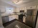 Modern kitchen with granite countertops, stainless steel appliances at 222 Flat Creek Ct, Peachtree City, GA 30269