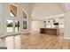 Open-concept living area flows into the kitchen, with high ceilings and ample natural light at 4711 H D Atha Rd, Covington, GA 30014