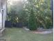 Well manicured backyard with small patio at 1253 Heartwood Ave, Mcdonough, GA 30253