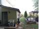 Cozy backyard features a shed, sink, patio, garden beds and a pergola, offering a blend of functionality and charm at 1253 Heartwood Ave, Mcdonough, GA 30253