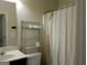 Bathroom featuring a shower with curtain and modern fixtures at 1253 Heartwood Ave, Mcdonough, GA 30253