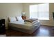 Bedroom with natural light, dresser, and a bed with linens on it at 1253 Heartwood Ave, Mcdonough, GA 30253