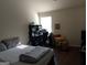 Bedroom featuring a bed, desk, and window, creating a comfortable living space at 1253 Heartwood Ave, Mcdonough, GA 30253