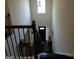 Entryway of the home featuring a grand staircase, a front door, and plenty of natural light at 1253 Heartwood Ave, Mcdonough, GA 30253