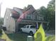 Two-story brick home featuring an attached garage and manicured front lawn at 1253 Heartwood Ave, Mcdonough, GA 30253