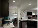 Open kitchen with granite countertops and stainless steel appliances at 1253 Heartwood Ave, Mcdonough, GA 30253