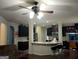 Open kitchen with granite countertops, breakfast bar, and stainless appliances at 1253 Heartwood Ave, Mcdonough, GA 30253