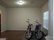 Living room with two motorcycles and a large window providing natural light at 1253 Heartwood Ave, Mcdonough, GA 30253