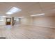 Spacious unfinished basement featuring vinyl plank flooring, a utility kitchen area and room to entertain guests at 13819 Woolsey Rd, Hampton, GA 30228