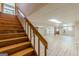 Large basement with wood-look flooring and staircase at 13819 Woolsey Rd, Hampton, GA 30228