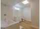Bathroom featuring bright tiling, a shower and tub combination and a modern vanity and light fixture at 13819 Woolsey Rd, Hampton, GA 30228