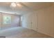 Bedroom with neutral carpet, and natural light from the large window at 13819 Woolsey Rd, Hampton, GA 30228