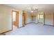 Cozy bedroom featuring carpet flooring, a ceiling fan, and access to a full bathroom with a sink and vanity at 13819 Woolsey Rd, Hampton, GA 30228