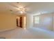 Spacious bedroom with neutral carpet, and attached bathroom and closet at 13819 Woolsey Rd, Hampton, GA 30228