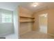 Walk-in closet with built-in shelving at 13819 Woolsey Rd, Hampton, GA 30228