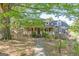 Charming brick home featuring a welcoming front porch and well-manicured landscaping under the shade of mature trees at 13819 Woolsey Rd, Hampton, GA 30228