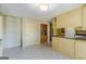 Spacious kitchen with built in shelving and appliances, including a cooktop at 13819 Woolsey Rd, Hampton, GA 30228