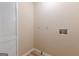 Functional laundry room with wooden-style flooring and a white bifold door for easy access and storage at 13819 Woolsey Rd, Hampton, GA 30228