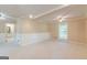 Spacious living room with a brick fireplace, and a hallway leading to the bathroom at 13819 Woolsey Rd, Hampton, GA 30228