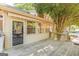 Covered patio featuring a door to enter the home, multiple windows and a wood floor at 13819 Woolsey Rd, Hampton, GA 30228