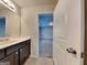 Bright bathroom featuring dark cabinets and a clear view of the bedroom at 1162 Ida Woods Ln # 23, Lawrenceville, GA 30045
