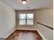 Bright hallway featuring hardwood floors and a clear view of the neighborhood at 1162 Ida Woods Ln # 23, Lawrenceville, GA 30045