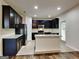Well-appointed kitchen featuring stainless steel appliances, granite countertops, and stylish cabinets for a contemporary feel at 1162 Ida Woods Ln # 23, Lawrenceville, GA 30045