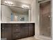 Luxurious main bathroom featuring a double vanity, a large mirror and a glass-enclosed shower at 1162 Ida Woods Ln # 23, Lawrenceville, GA 30045