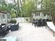 Spacious backyard deck with outdoor dining and seating areas, perfect for entertaining guests at 15 Perthshire Dr, Peachtree City, GA 30269