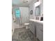 Bathroom featuring gray double vanity, modern fixtures, and floral shower curtain at 15 Perthshire Dr, Peachtree City, GA 30269