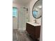 Modern bathroom featuring a glass-enclosed shower, stylish vanity, modern fixtures, and tile flooring at 15 Perthshire Dr, Peachtree City, GA 30269