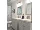 Stylish bathroom with gray double vanity, modern fixtures, and floral shower curtain at 15 Perthshire Dr, Peachtree City, GA 30269