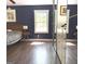 Primary bedroom with wood floors, window, and mirrored closet doors at 15 Perthshire Dr, Peachtree City, GA 30269