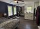 Primary bedroom with a bed, ceiling fan, and mirrored closet doors at 15 Perthshire Dr, Peachtree City, GA 30269