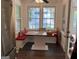 Cozy breakfast nook featuring bench seating and a table, with natural light streaming through the windows at 15 Perthshire Dr, Peachtree City, GA 30269