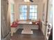 Bright breakfast nook features built-in banquette seating and view of the yard at 15 Perthshire Dr, Peachtree City, GA 30269