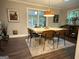 Bright dining room with a modern table, wooden chairs, and large windows at 15 Perthshire Dr, Peachtree City, GA 30269