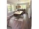 Well-lit dining room with a large table, comfortable seating, and classic decor at 15 Perthshire Dr, Peachtree City, GA 30269